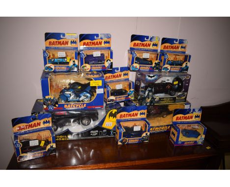 A Corgi Bat Cycle; together with eleven boxed Batmobiles.