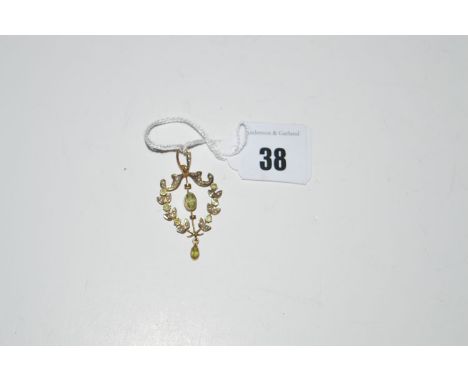 An Edwardian peridot and seed pearl drop pendant, stamped 'H & W 9ct.'.