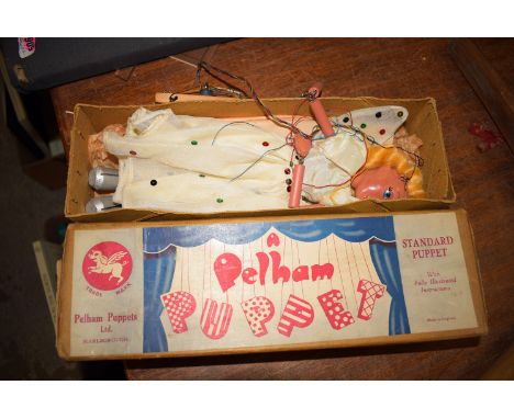 A Pelham puppet in original box.