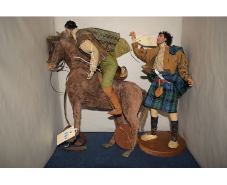 A soft toy model of a Highlander in highland dress and a sword, mounted on circular wooden plinth base; and another soft toy 