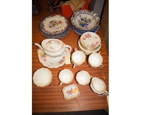 A Royal Crown Derby bone china 'Derby Posies' six place setting tea service; together with a quantity of decorative plates.