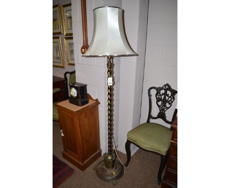 An oxidised brass standard lamp and shade.