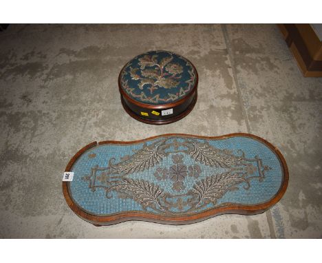 A Victorian mahogany footstool upholstered in floral Berlin work; together with a walnut and Berlin work teapot stand.