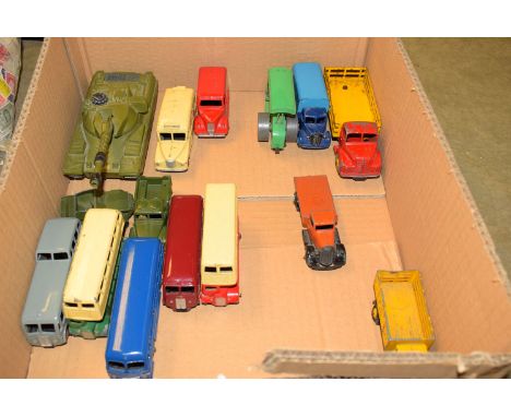 A collection of five Dinky die-cast model coaches, comprising: an observation coach; a cream and green double decker bus; a D