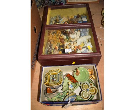 A glazed table case containing a quantity of Wade Whimsies; and other ceramic ornaments; together with a box of Wade ashtrays