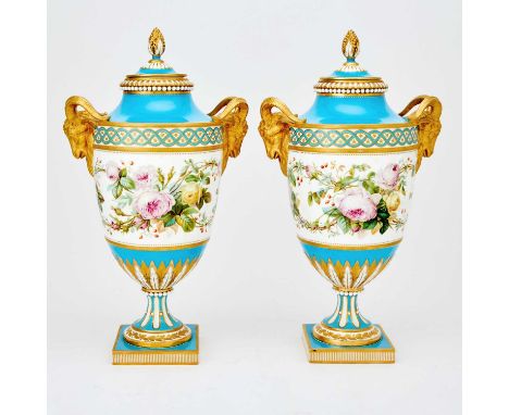 Gilt decorated with Ram's heads, painted in light blue and with yellow and pink roses on a white background. Height 17 inches