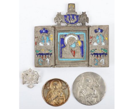 A naïve metal and enamel triptych icon, with two unmarked circular panel mounlds of religious scenes, with a Russian Imperial