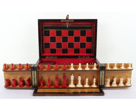 A Victorian burr walnut games compendium, hinged lid and front opening doors revealing fitted interior of stained ivory chess