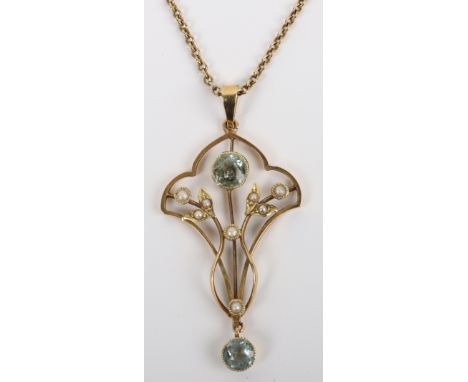 An Art Nouveau 15ct gold, aquamarine and pearl open work pendant necklace, centre round aquamarine 0.49 carats, a further aqu