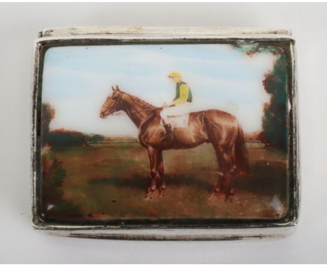 A silver pill box with enamel horse rider to the lid, London import marks, 3.5cmW