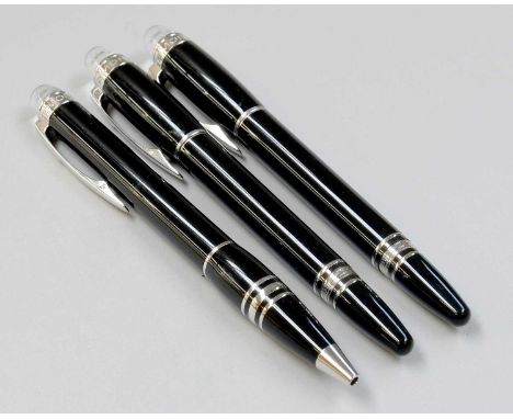 Three Montblanc Starwalker Pens, each with black resin body and white mounts, comprising a fountain-pen, with screw cap, numb