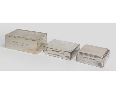 Three Silver Cigarette-Boxes, two oblong and one square, the two oblong boxes each engine-turned, the front of the largest bo