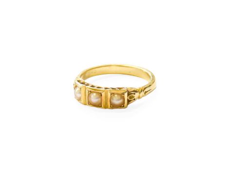 A Split Pearl Ring, three split pearls in yellow square settings, to trefoil shoulders on a plain polished shank, finger size