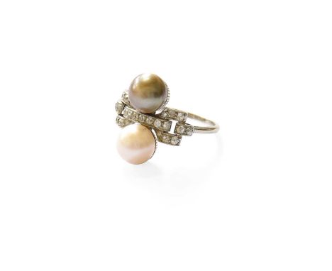 A Pearl and Diamond Ring, the buckle motif set throughout with old cut diamonds, in white claw and channel settings, flanked 