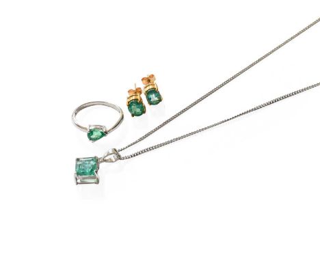 A 9 Carat White Gold Emerald Ring, the pear cut emerald in a claw setting, to a crossover plain polished shank, finger size N
