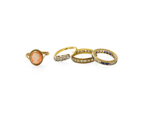 A Diamond Five Stone Ring, the graduated round brilliant cut and eight-cut diamonds in white illusion settings, to a yellow t