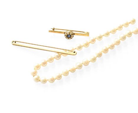 A Cultured Pearl Necklace, with a 9 carat gold clasp, length 45.5cm; A 9 Carat Gold Brooch, length 6.4cm; and A Sapphire and 
