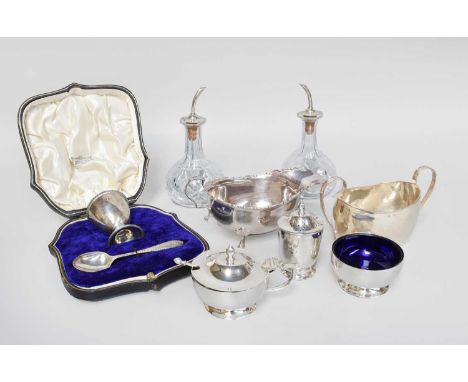 A Collection of Assorted Silver and Silver-Mounted Items, including a sauceboat; a sugar-bowl; a three-piece condiment-set; a