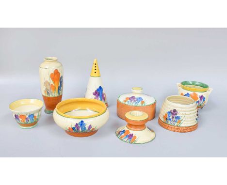 A Clarice Cliff Pottery Sugar Sifter, "Crocus" pattern, of conical form, Newport pottery, together with other examples in the