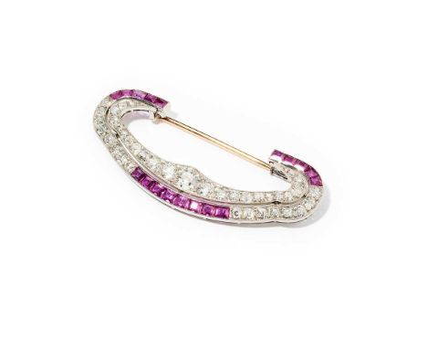Chaumet: An Art Deco ruby and diamond brooch, circa 1930 Of stylised crescent form, millegrain-set with a row of graduated ol