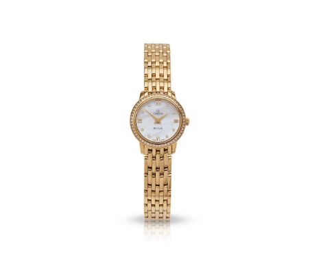 Omega: A diamond-set wristwatch De Ville model, 18ct gold case, signed Omega 1376 quartz movement, signed round mother-of-pea