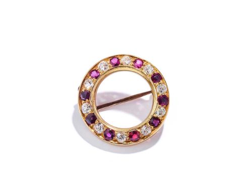 A ruby and diamond brooch Designed as a circlet, set with alternating cushion-shaped rubies and old brilliant-cut diamondsDim