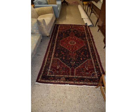 LARGE RUG WITH STYLISED FLORAL DESIGN AROUND CENTRAL GEOMETRIC PANEL