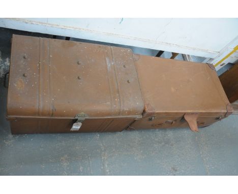 A Vintage metal domed tin trunk and a vintage leather suitcase.(2)