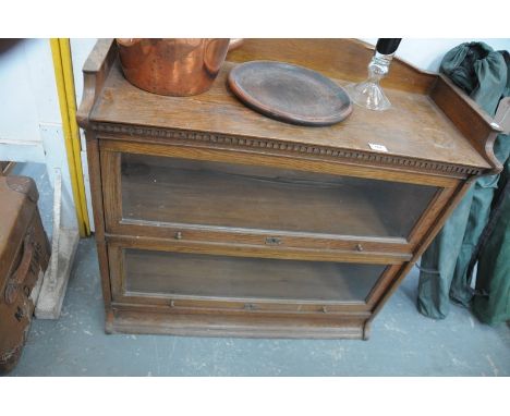 An Early 20th century oak Globe Wernick style 2 tier stacking bookcase.