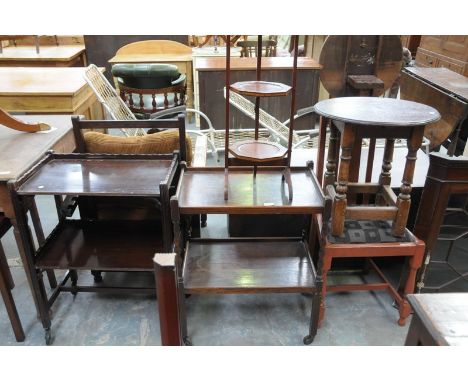 An Edwardian inlaid mahogany 3 tier folding cakestand, an oak barley twist tea trolley , a mahogany tea trolley and 2 mahogan