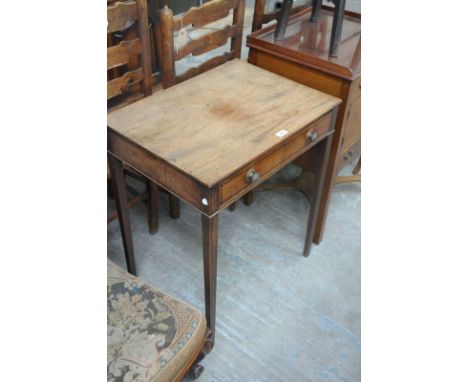 A Georgian mahogany single drawer side table on tapering legs of square section.