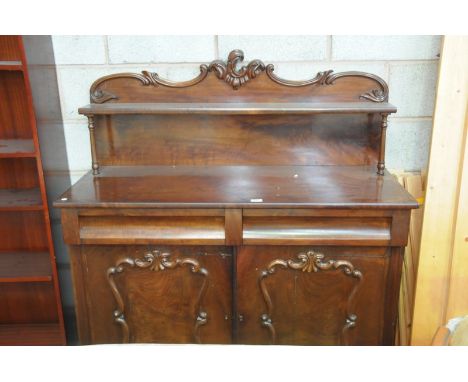 A 19th Century mahogany chiffonier with a  raised back centred with a leafy scroll crest above a single shelf, rectangular  t