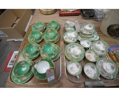 A Crown Staffordshire green and gilt floral pattern tea service and a similar Tuscan tea service to 2 trays.