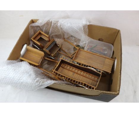 Four kit built wooden carts and trailers, with metal rimmed wheels, together with a selection of model agricultural tools