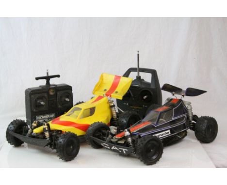 Two vintage Schumacher electric remote control cars together with two remote controls