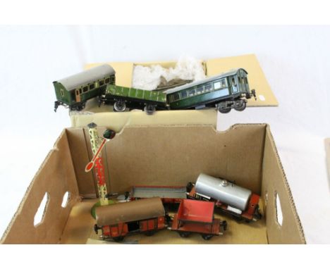 Seven Marklin O gauge items of rolling stock to include tipping wagon, wagons and coaches plus a quantity of track (2 boxes)