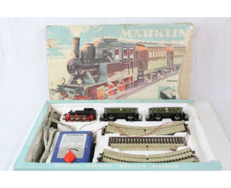 Boxed Marklin HO gauge electric train set to include 0-6-0 locomotive, rolling stock and track, play worn with controller dam