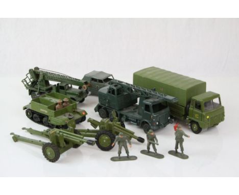 Seven Dinky military diecast models and artillery to include Servicing Platform, American 105mm Gun etc, some play wear but g