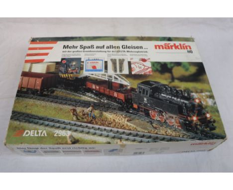 Boxed Marklin HO scale Delta 2963 train set with locomotive, 4 x items of rolling stock, track and controller