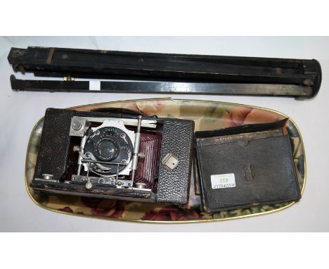 A Delta folding camera with tripod; other items