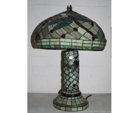 A Tiffany style lamp with coloured and beaded glass base and shade