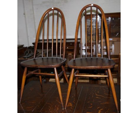 A set of 4 Ercol hoop and stick back dining chairs