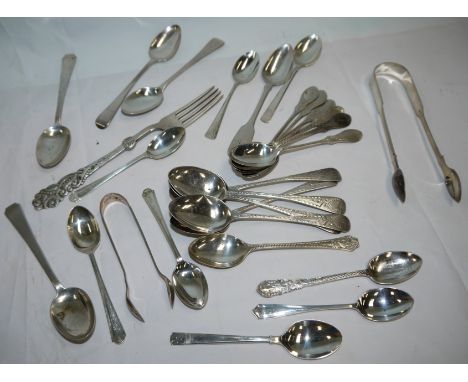 A large selection of hallmarked silver teaspoons; etc.; a continental fork and 2 teaspoons