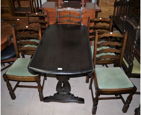 A matched oak reproduction dining suite comprising oval drop leaf table and 6 ladder back chairs