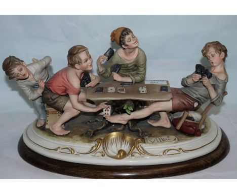 A Capodimonte porcelain figure group of boys playing card, width 15"