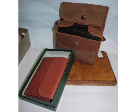 A Gucci leather purse, boxed; an African letter case; a box camera
