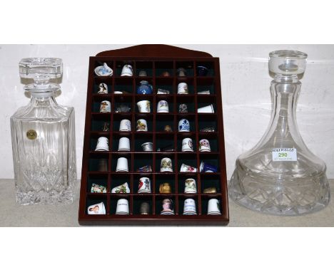 A Heavy Cut glass wide base decanter, a modern R C R decanter and a selection of various thimbles