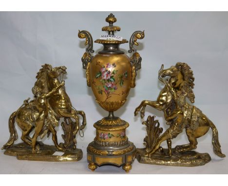 A 19th century mantel urn, silver ormolu mounted, the gilt porcelain centre with enamelled flowers, 11"; a pair of gilt brass