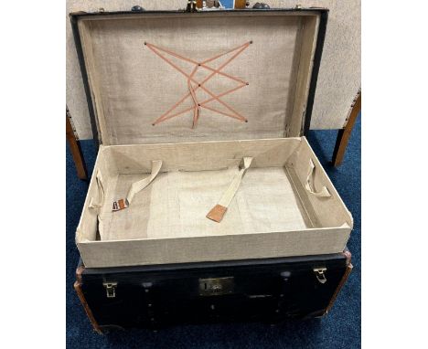 Antique military style travel trunk. Wooden bound, brass locks and has interior drawer present. [46x71x49cm]