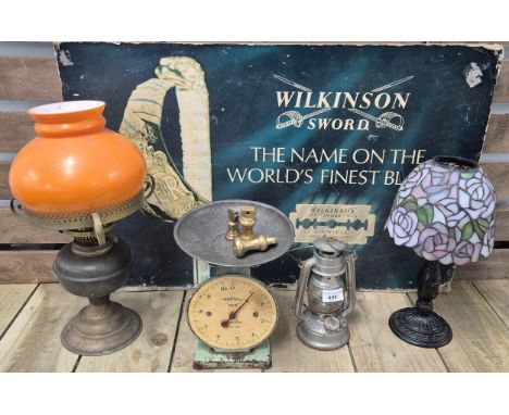 A selection of collectables; vintage Wilkinson sword advertising sign, oil lamp with vintage orange glass shade, Waymaster sa